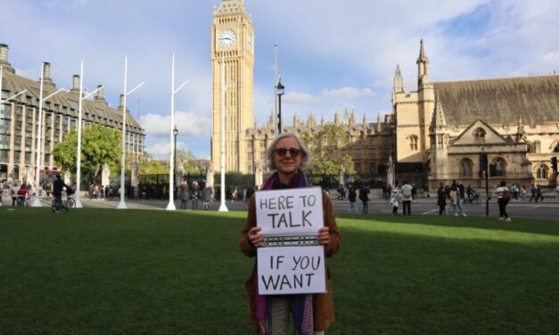 Woman Faces Trial for Holding Sign Outside Abortion Clinic Saying, “Here to Talk if You Want”